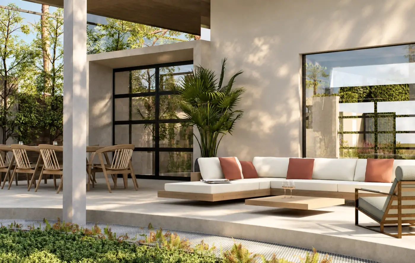 Rendering of a covered patio with a sectional sofa and dining table beside a planted courtyard