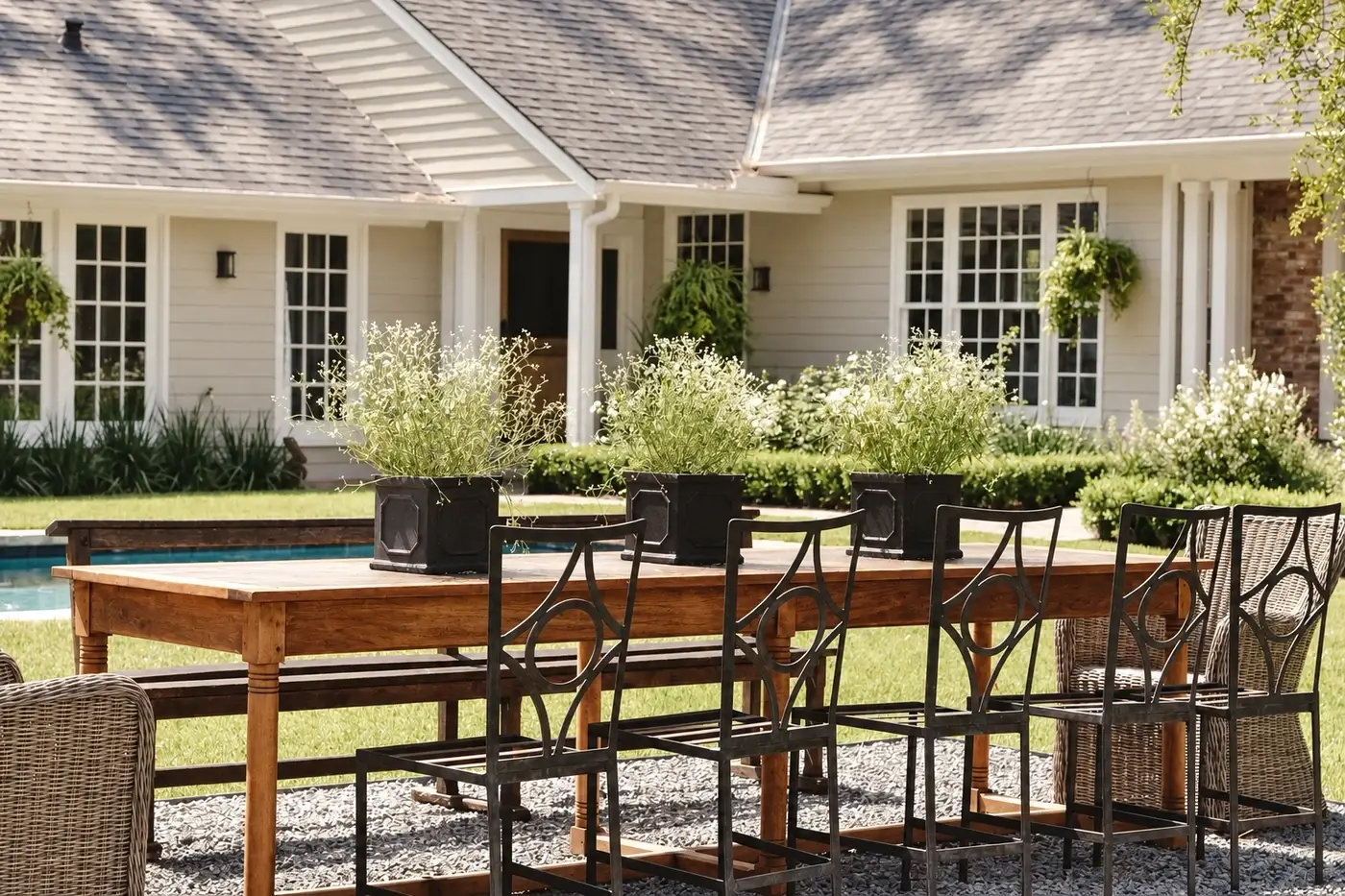 Long dining table on a terrace by the pool