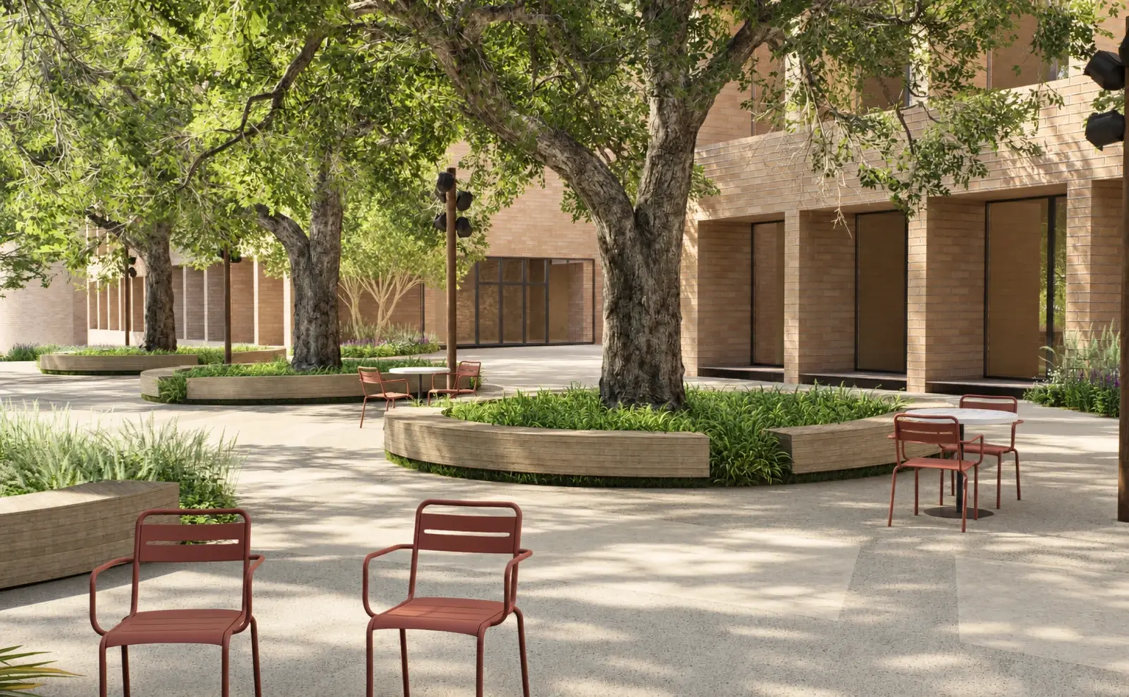 Rendering of a courtyard with a tree, round bench and red chairs