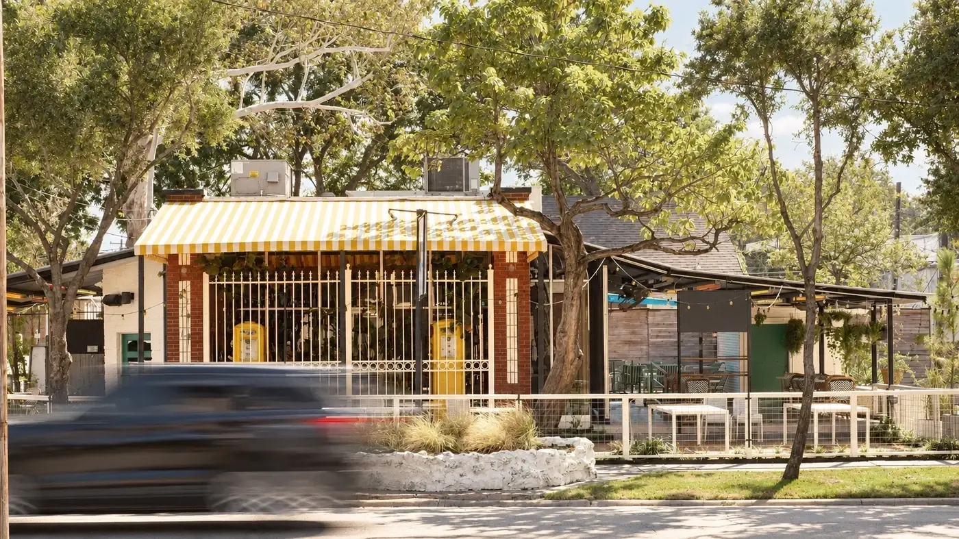 Pavilion under live oaks seen from the street